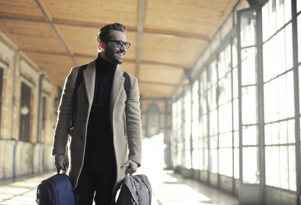 Business man carrying his luggage and traveling to Guatemala after receiving a business visa in Guatemala. 